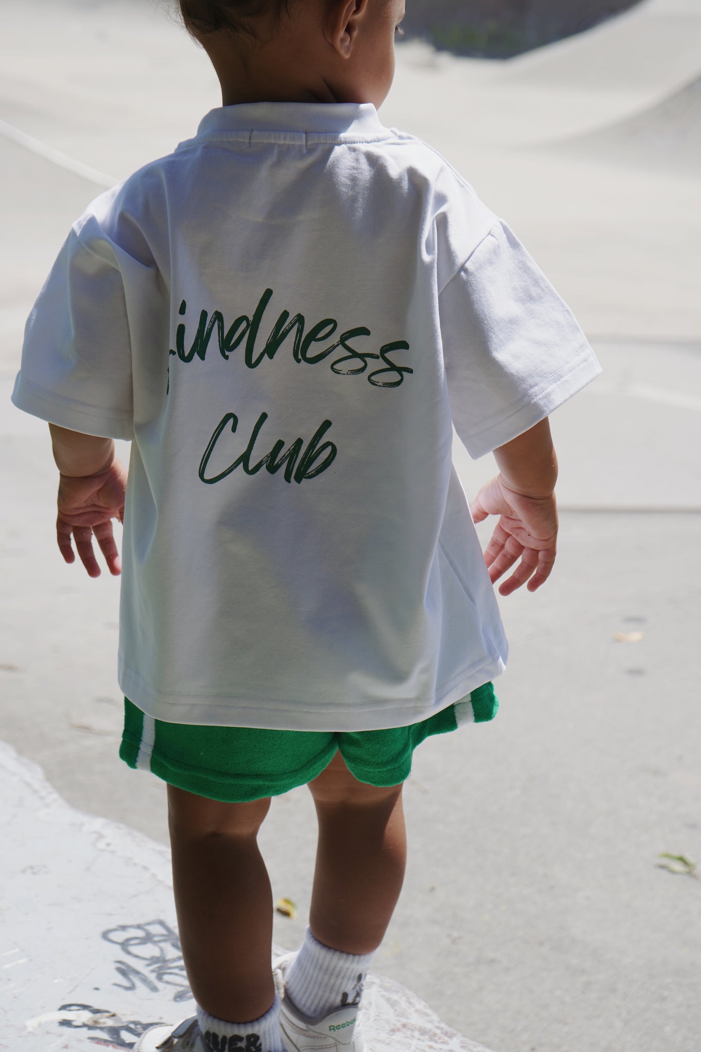 Kindness Club green t-shirt